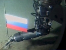 Russian flag being planted under the North Pole