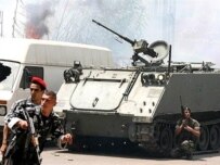 Lebanese battling Fatah al-Islam last week (AFP)