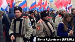 Pro-Kremlin supporters march as they celebrate National Unity Day in Moscow on November 4.