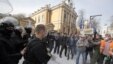 Protesters in Kyiv confront riot police during a rally in Kyiv on April 8. Demonstrators were demanding an urgent reform of law enforcement and the transparent nomination of a new prosecutor-general. 