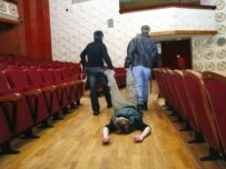 Actors rehearse a scene from \