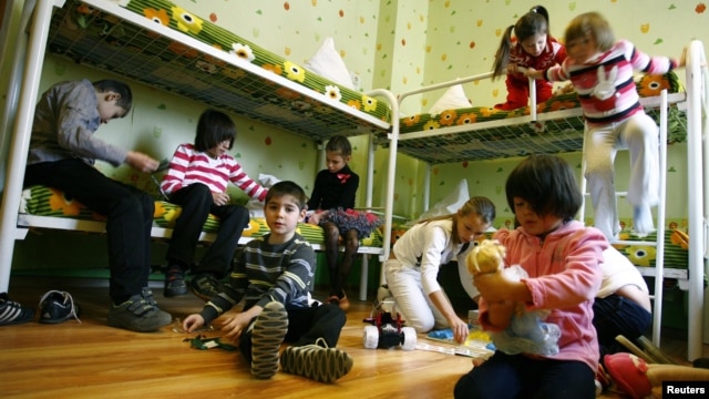 Children play in their bedroom at an orphanage in the southern Russian city of Rostov-na-Donu.