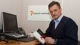 Radio Svaboda journalist Aleh Hruzdzilovich with his book, "Who Blew Up the Minsk Metro?" 