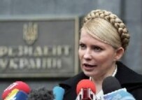 Tymoshenko speaking to journalists after coalition talks with Yushchenko in March (epa)