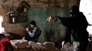 Fighters from the Islamist Syrian rebel group Jabhat al-Nusra on the front line during a clash with Syrian forces loyal to President Bashar al-Assad in Aleppo in December.