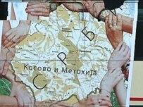 A defiant map emphasizing Kosovo as part of Serbia adorns a bus in Belgrade (AFP)