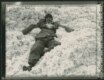 A man reclines on a pile of freshly harvested cotton