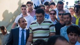 Azerbaijan -- Azerbaijani military officer Ramil Safarov, center, walks in Martyrs' Alley, national memorial in the Azerbaijan's capital Baku, 31Aug2012