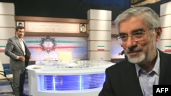 Mir Hossein Musavi leaves the studio after his debate with incumbent Mahmud Ahmadinejad.