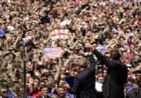The U.S. and Georgian presidents greet the crowd at Tbilisi's Freedom Square on 10 May