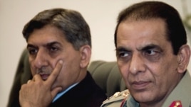 Pakistani Army chief General Ashfaq Parvez Kayani (right) and Inter-Services Intelligence (ISI) chief Ahmad Shuja Pasha attend an inaugural meeting of a Pakistan-Afghanistan joint peace commission in Islamabad on June 11.