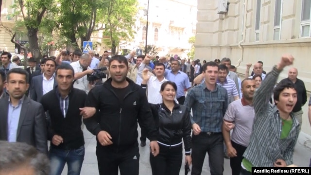 Some 100 opposition activists turned out for the unauthorized demonstration in Baku. 