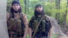 A screen grab of purported rebels "Saydi" and "Iskhak" as shown in a video posted on the Kavkazcenter website.