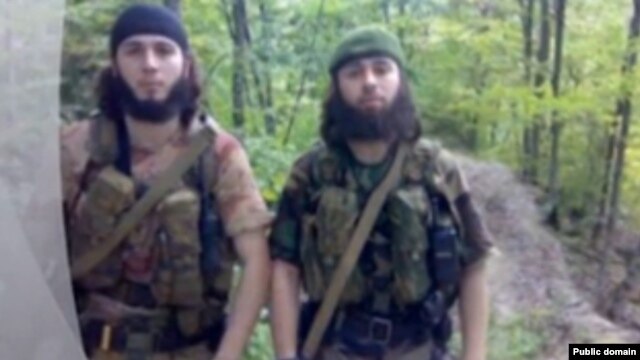 A screen grab of purported rebels "Saydi" and "Iskhak" as shown in a video posted on the Kavkazcenter website.