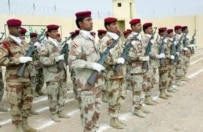 Iraqi security forces at a ceremony to hand over security responsibility in Karbala in October 2006 (epa)