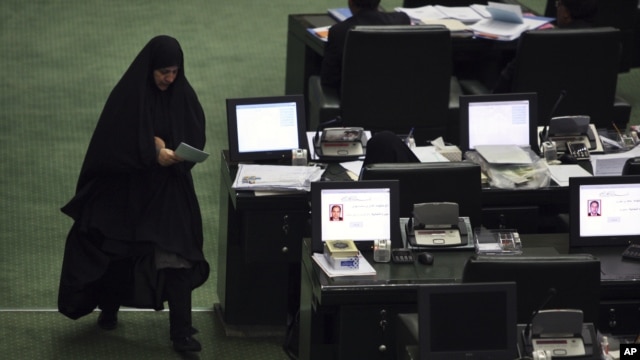 A lawmaker walks through the parliament in Tehran on August 17.