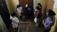 Kyrgyz women and their children are detained during a police raid on migrant workers in downtown Moscow last year.