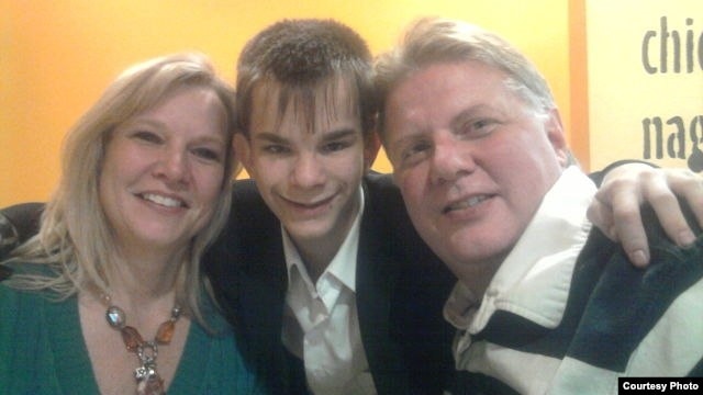 Russian teenager Maksim Kargapoltsev (center) with Mil (right) and Diana Wallen, the U.S. couple who want to adopt him.