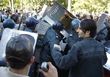 Police disperse a demo in Baku in 2005
