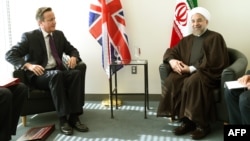 British Prime Minister David Cameron (left) meets with Iranian President Hassan Rohani at UN headquarters in New York on September 24.