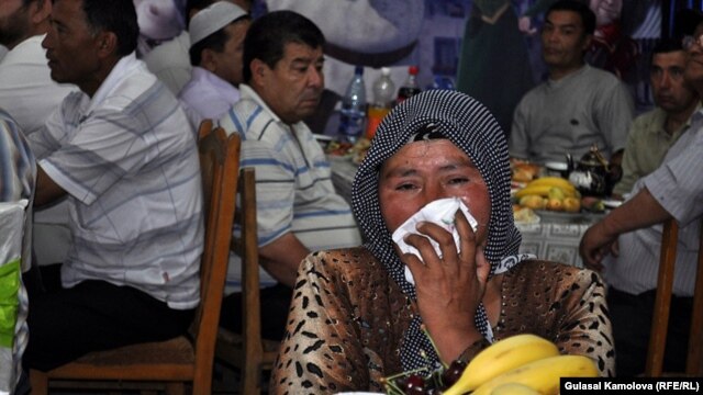 An Osh woman who lost her grandchild, son, and daughter during ethnic violence in June 2010 mourns at the commemoration ceremony on June 10.