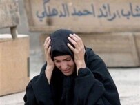 An Iraqi woman mourns a relative killed in the bomb attack (AFP)