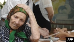 A woman waits for a ballot in Chisinau.