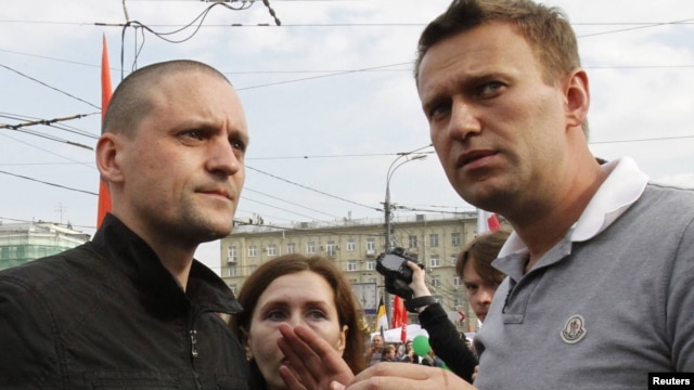 Sergei Udaltsov (left) and Aleksei Navalny speak at the May 6 opposition rally.