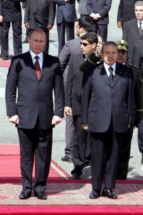 Putin (left) arriving in Algers in March (epa)