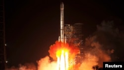 A rocket, carrying the "Chang'e-3" lunar probe, blasts off from a launch pad in China on December 2.