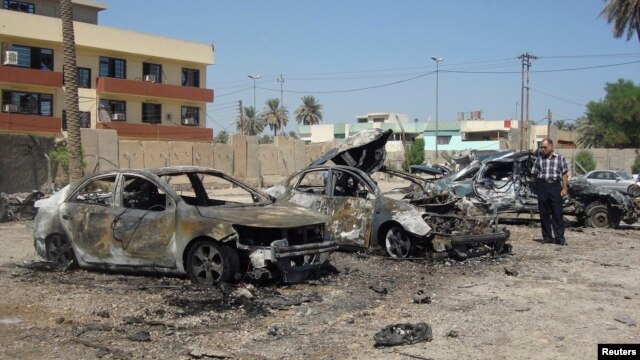 The site of a recent car bomb attack in Baghdad's Kadhimiya district