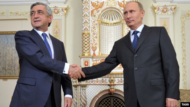 Russian President Vladimir Putin (right) meets with his Armenian counterpart Serzh Sarkisian in Moscow on September 3. 