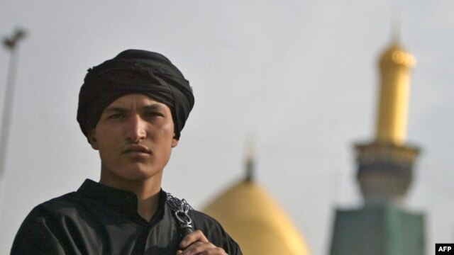 A Shi'ite Muslim in Iraq holds chains used in self-flagellation outside the Imam Hussein shrine during the Ashura observation in Karbala in December 2009.