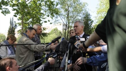 Serbian presidental candidate Tomislav Nikolic talks to reporters after voting in Belgrade on May 20.