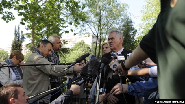 Serbian presidental candidate Tomislav Nikolic talks to reporters after voting in Belgrade on May 20.