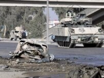 U.S. troops securing the area around one of the car-bomb blasts in Baghdad today (epa)