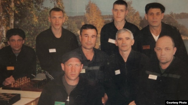 Valentin Danilov (middle row, second from right) and other inmates in their Siberian prison (undated)
