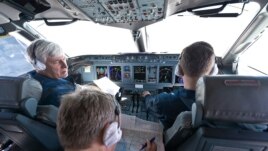 Sukhoi's chief civil test pilot, Aleksandr Yablontsev (left), and his crew sit in the cockpit of a Sukhoi Superjet during a flight on May 8, one day before the deadly crash in Indonesia.