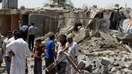 Gërmadhat në qytetin Taji në Irak pas një sulmi të mëparshëm 