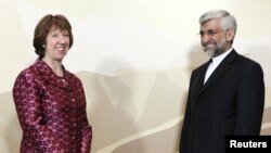 Iran's chief nuclear negotiator Said Jalili (right) and European Union foreign policy chief Catherine Ashton before talks in Almaty on April 5.