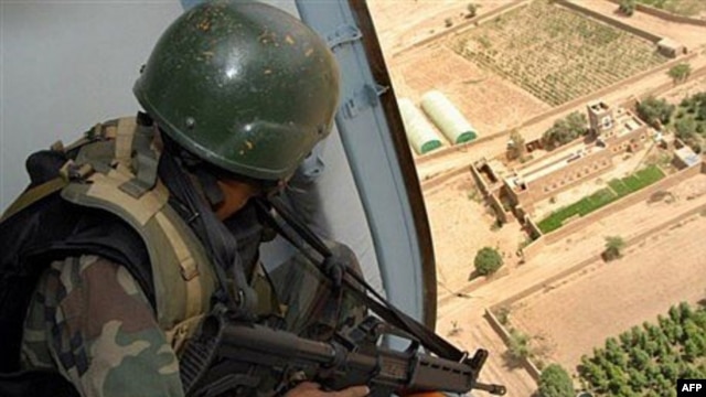 A Yemeni soldier sitting inside a helicopter as it patrols over a rebel stronghold (file photo)