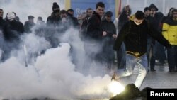 Police and protesters clash at the Merdare border crossing