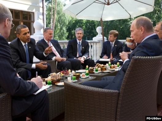U.S. President Barack Obama (second from left) and Russian Prime Minister Vladimir Putin (right) meet at the latter's country residence outside Moscow in July 2009.