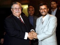 Iraqi President Jalal Talabani (left) with Iranian President Mahmud Ahmadinejad in Tehran on November 27 (Fars)