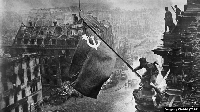 Is  it 1945 all over again? Red Army soldiers hoist the Soviet flag over the Reichstag in Berlin at the end of World War II.