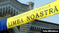 A sign celebrates the "Day of Romanian Language" in Chisinau, Moldova.