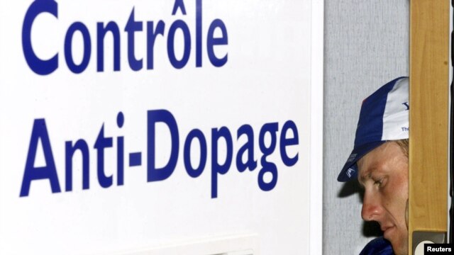 Lance Armstrong in a doping-control van after his victory in a time trial during the Tour de France cycling race in 2001, when he won the third of his unprecedented seven consecutive Tour titles