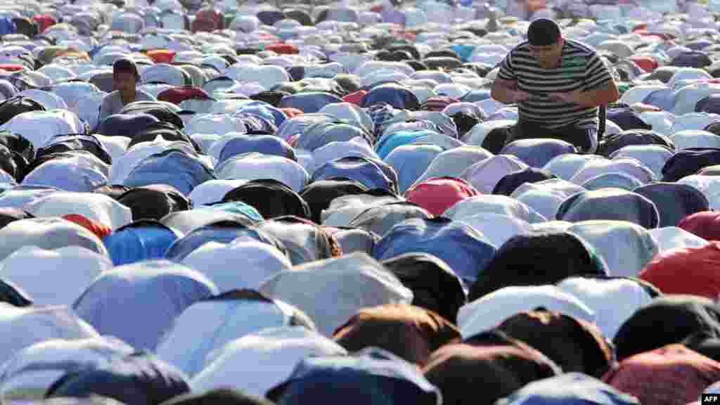 Muslims pray on the first day of Eid al-Fitr on a square in central Bishkek.