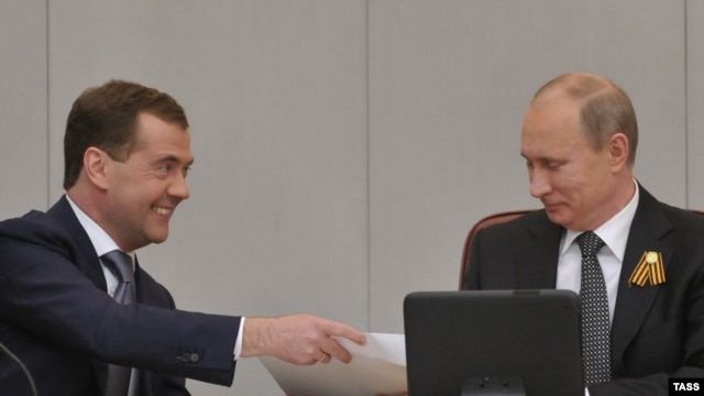Russian President Vladimir Putin (right) with Dmitry Medvedev at a special session of the State Duma in Moscow, which confirmed Medvedev's appointment as prime minister.