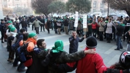 Armenia - Environmental activists demonstrate outside a government building in Yerevan against mining in Syunik, 29Dec2011.